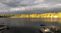 Beautiful Lake House with 150' sandy beach on 85 acre all sports lake