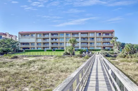 Oceanfront Condo with Spacious Patio and Private Walkway to the Beach by RedAwning