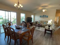 Charming Corner Lot with Golf Cart and Screened Lanai - Inviting Escape