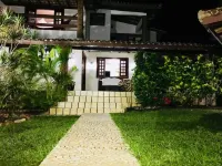 Cozy and charming house with pool and gardens in sea front condominium!