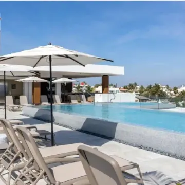 ACROSS THE STREET FROM OCEAN! Stunning Condo with Private Pool/patio