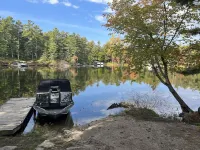 Timber cottage with large deck overlooking the water. Boat access only, no road.