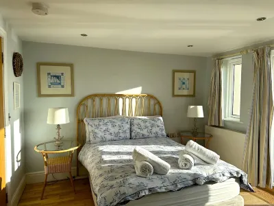 Out Of The Blue Is Situated In A Breathtaking Location Overlooking Croyde Beach. Hotels near Surfer's Paradise Croyde Bay Campsite