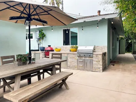 Walk to the beach or relax and grill outdoors in the amazing yard!