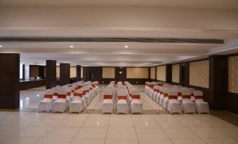 a large , empty banquet hall with rows of chairs and tables set up for an event at Hotel Lake View