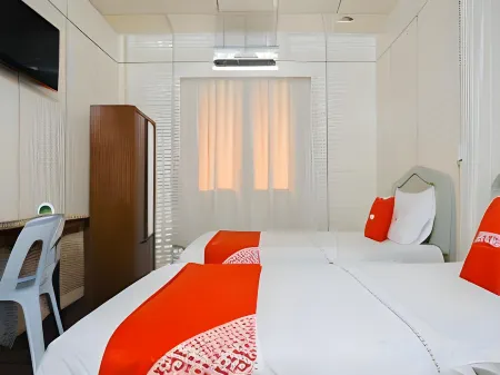 Hotel O the 7 Lodge Tambunan Отели рядом с достопримечательностью «Holy Cross Catholic Church Toboh»