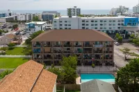 Contemporary, clean 1-bedroom mid-town condo with bay view and 1 block to beach.