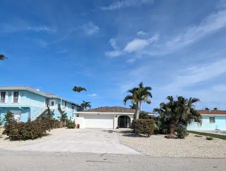 3 Bed 2 Bath on Deep Canal 5 minutes to channel CLEAN & NICE. New boat hoist