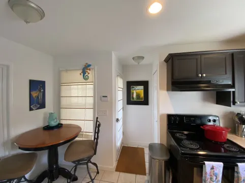 One mile to the beach!  2 br condo with deck, A/C, full kitchen, washer, dryer