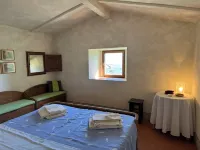 Poggio Corsucci - Il Nido: intimate stone house with pool and enchanting views