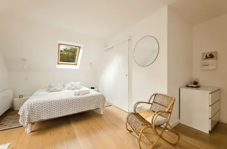 In a green setting close to the ocean