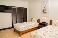 Tranquil 2 Bedroom Rental - 5 Mins to Beach, Private Deck, Pool & Hot Tub Access