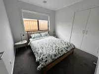 Brand new, spacious family home in walking distance to beach.