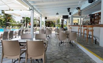 an outdoor dining area at a restaurant , with tables and chairs arranged for guests to enjoy their meals at Elizabeth