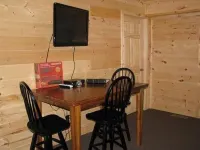 3BR, 1 Bath Cabin with hot tub, full kitchen, and living room.