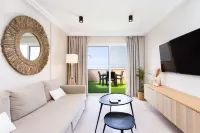 APARTMENT A few meters from a black sand beach.