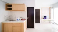 Homey and Comfy 2Br Apartment at Suncity Residence Hotels in Buduran