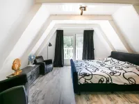 A Detached Bungalow with Outdoor Fireplace Covered Terrace and Pond in a Forest Plot