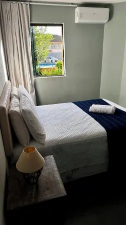 Beachfront · 2-bedroom apartment with pool, Wi-Fi, and garage in Vilas do Atlântico