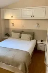 1 bedroom wooden caravan with pool and barbecue. sleeps up to 3 people
