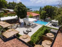 Slow Life Bali Coast Holiday Hotel - Inns