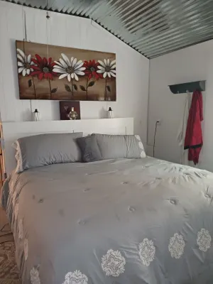 The Butterfly large Cabin with a king-size bed.  kitchenette and jacuzzi bathtub