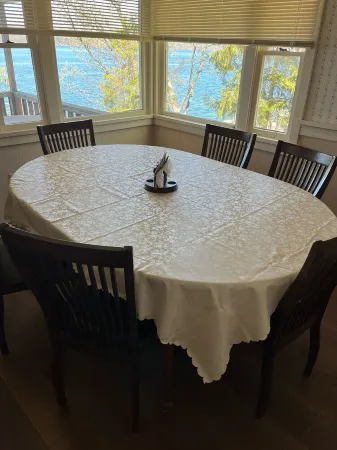 Lakefront cottage with private deck and dock, amazing porch with sunset views