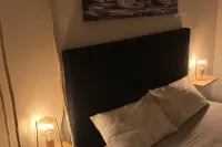 Lake view apartment with large hydromassage tub directly in the bedroom.
