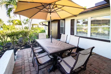 Three-bedroom home with backyard heated pool oasis. 5 minutes to the beach