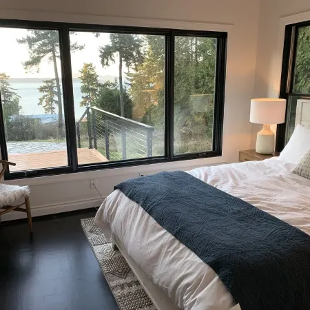 Amazing sunsets!! Water view, hot tub, close to town, fire pit.