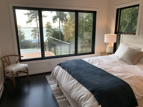 Amazing sunsets!! Water view, hot tub, close to town, fire pit.