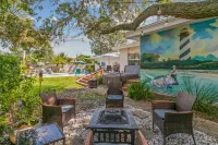 Iconic Front Porch and Timeless Charm - Charming Poolside Oasis