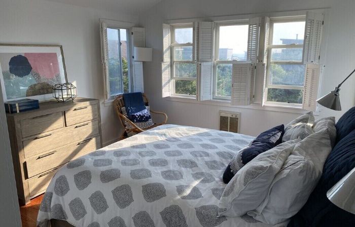 Bright airy Fair Harbor home with ocean views steps from the soft sandy beach