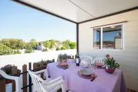 Bungalow with pool in a park-like garden by the sea! 스칼리노 호텔