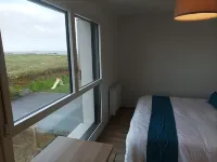 Recent house facing the dunes and Grève Blanche beach, at the foot of the GR34.