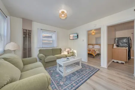 Walk to the beach or Sunset Lake with a front yard and Pet-Friendly!