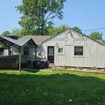 The White House w/ Hot Tub Portage Lakes Fenced Yard Pet-Friendly!