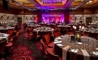 a large banquet hall with multiple tables and chairs set up for a formal event at Thunder Valley Casino Resort