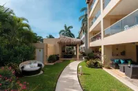 Relajate hermoso jardín y 2 piscinas Hôtels à : Puerto Aventuras