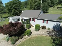 Cozy home in a peaceful country setting with stocked pond. Relax and unwind.
