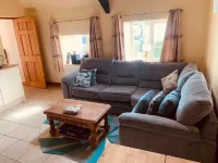 Whitewashed 1 bedroom stone cottage, with king size 4 poster bed. Pet friendly.