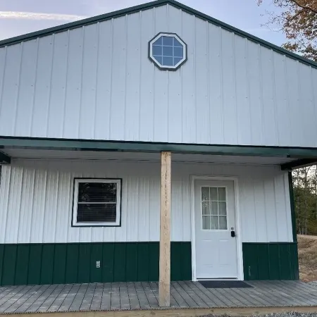White cabin in the woods close to Univ. of Central Missouri and Whiteman AF Base
