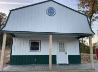 White cabin in the woods close to Univ. of Central Missouri and Whiteman AF Base