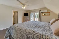 Lakehouse with covered dock, slide, and outdoor kitchen! Close to I-75, trails.