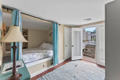 Ocean view spacious 5-bedroom Cape Cod style house with roof deck, AC, WiFi.