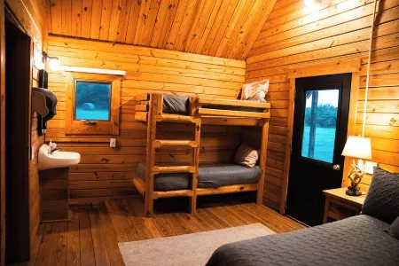 Charming cabin with loft, porch swing, AC, and WiFi on 295-acre peaceful retreat