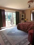 Spacious vacation apartment with fireplace and barrel sauna in the sheltered garden.
