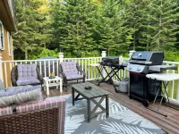 Spacious five-bedroom home off Back Lake with direct trail access on Spooner Rd