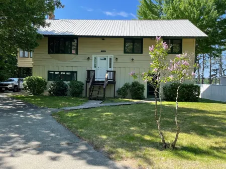 Lakefront home on Leavitt Bay, with private beach, dock, and an amazing view
