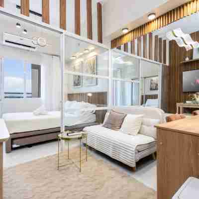 Elegant Wood-Accent Studio with Balcony Rooms